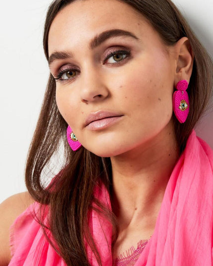 Kralenoorbellen met oog Fuchsia