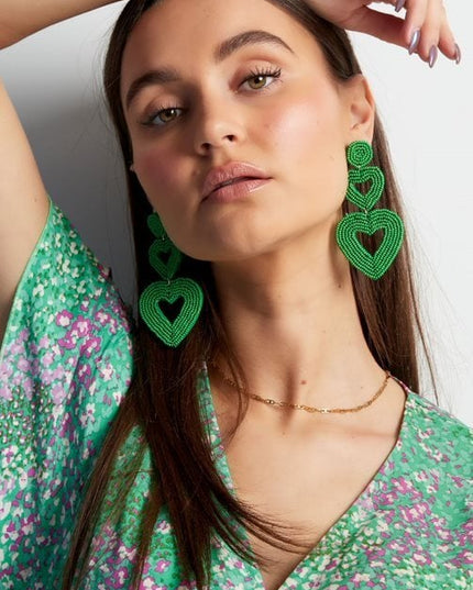 Dubbele hart oorbellen lichtblauw Glas