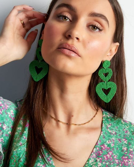 Dubbele hart oorbellen paars Glas