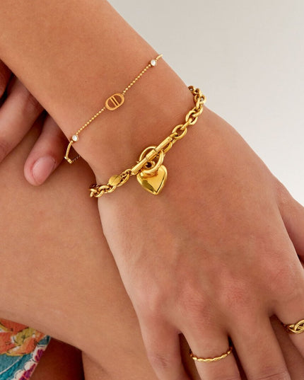 Armband logo's en steentjes - goud