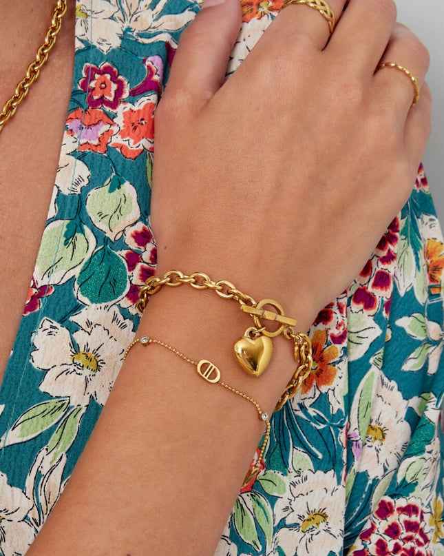 Armband logo's en steentjes - goud