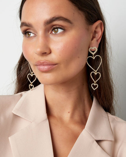 Oorbellen hartjes slinger - Goud