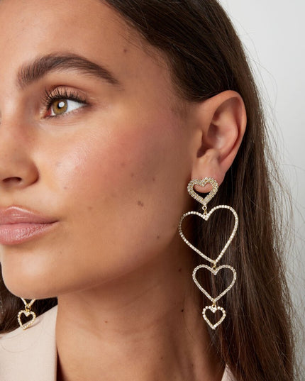 Oorbellen hartjes slinger - Goud