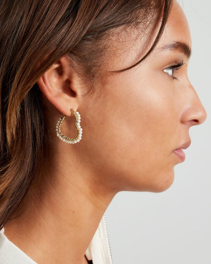 Hartjes vormige oorbel met parels - goud