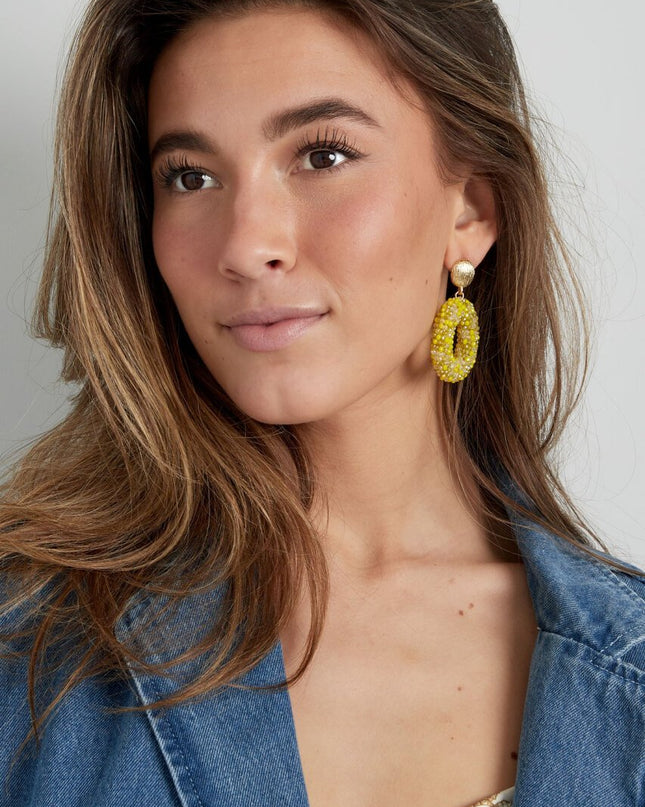 Ovale discodip oorbel - beige goud