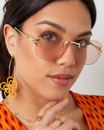 Zonnebril Ronde Glazen Gouden Detail Zwart Goud