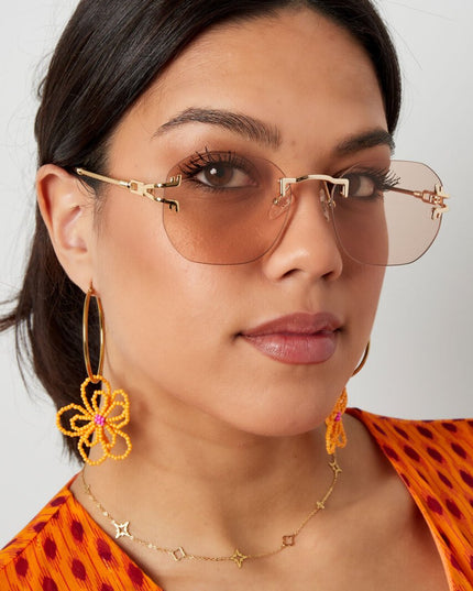 Zonnebril Ronde Glazen Gouden Detail Zwart Goud