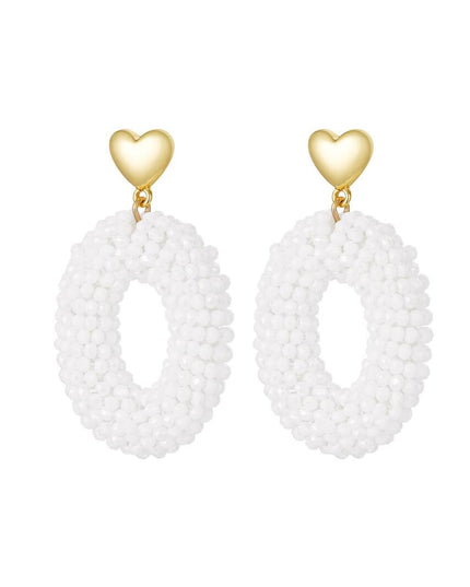 Oorbellen ovaal met kralen en hart detail wit