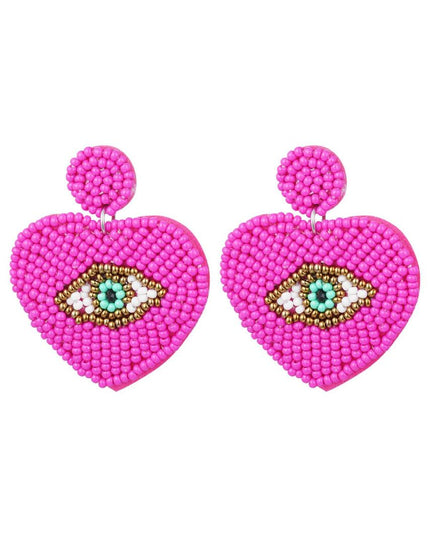 Kralenoorbellen met oog Fuchsia
