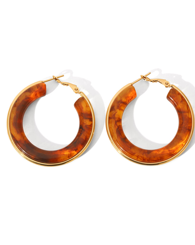 Oorbellen ringen bruin goud